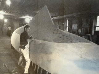a person from John Buchan homes working on a sailboat