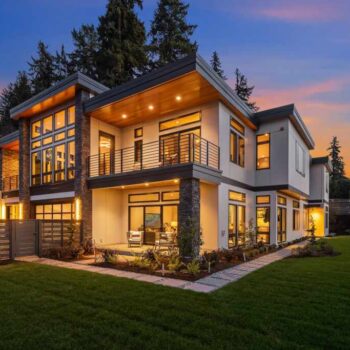 JBH home with lights on at night